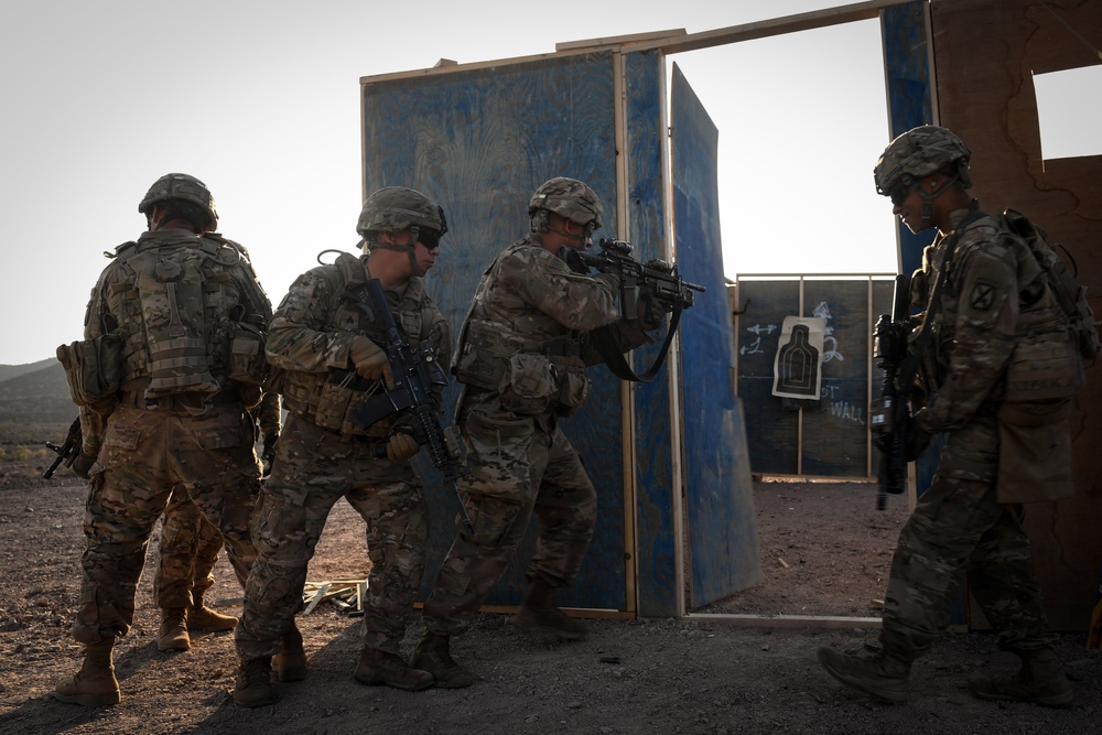 Soldiers conduct live fire shoot house training