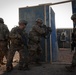 Soldiers conduct live fire shoot house training