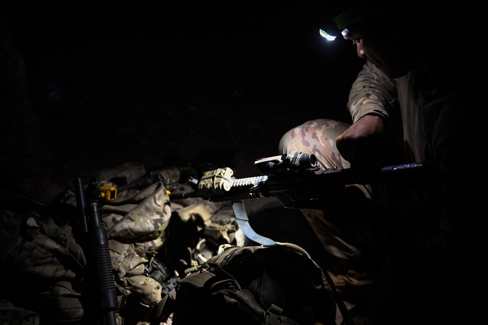 Soldiers conduct live fire shoot house training