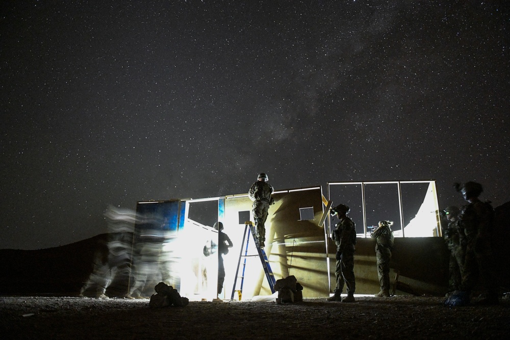 Soldiers conduct live fire shoot house training