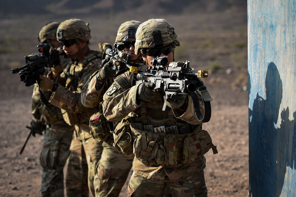 Soldiers conduct live fire shoot house training