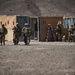 Soldiers conduct live fire shoot house training