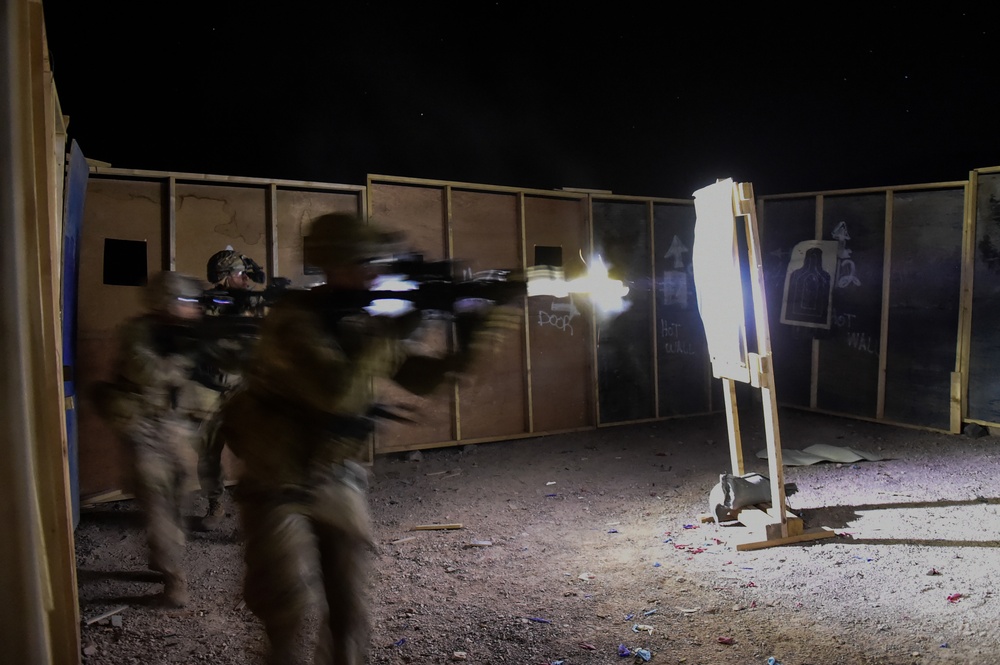 Soldiers conduct live fire shoot house training