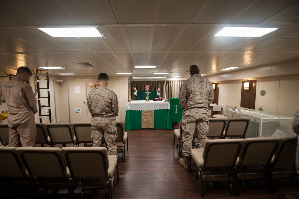 USS America Sailors and Marines hold morning mass