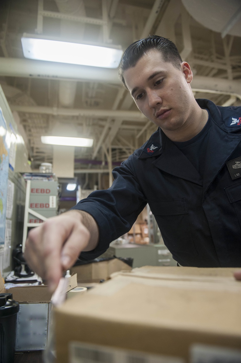 USS America Sailor process supplies