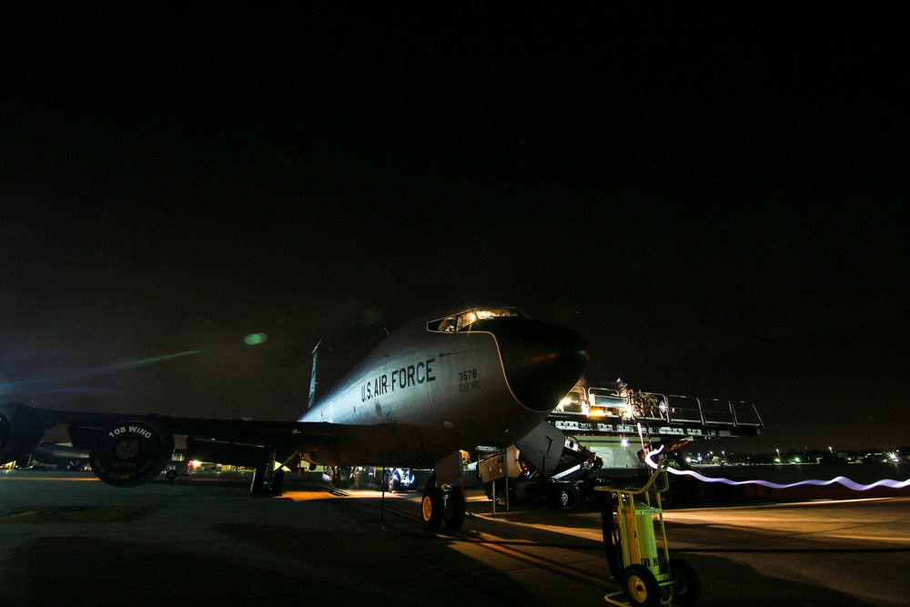 Unloading a KC-135 at night