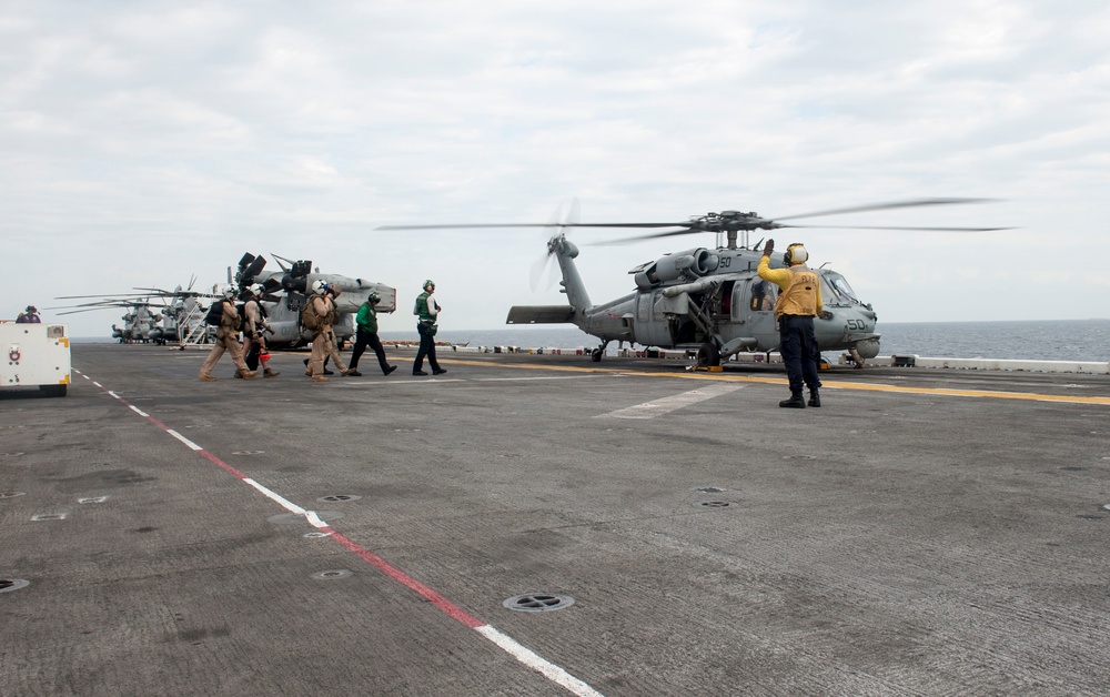 USS America Sailors and Marines board helicopter