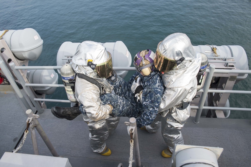 USS Bonhomme Richard's (LHD 6) sailors participate in fire drill on the flight deck.