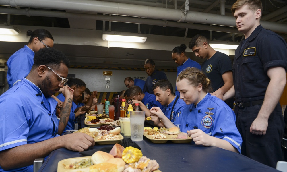 Nimitz Sailors Pray Before Meal