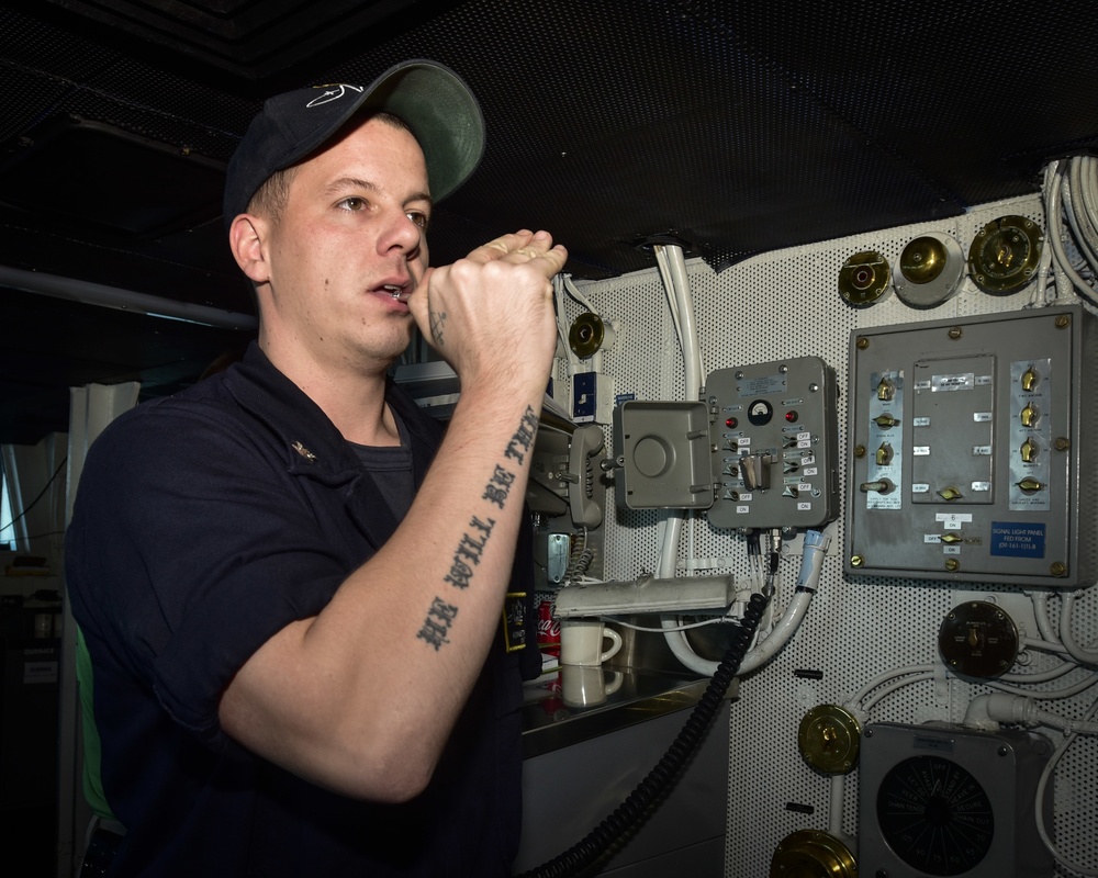 Nimitz Sailor Blows Boatswain's Pipe
