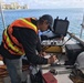 Dive supervisor manages dive operations on Pacific Paradise