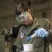 USS America Sailor mixes resin for composite repairs