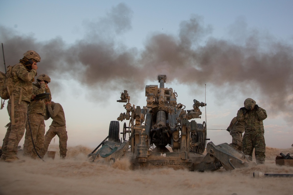 U.S. Army conduct field artillery strikes