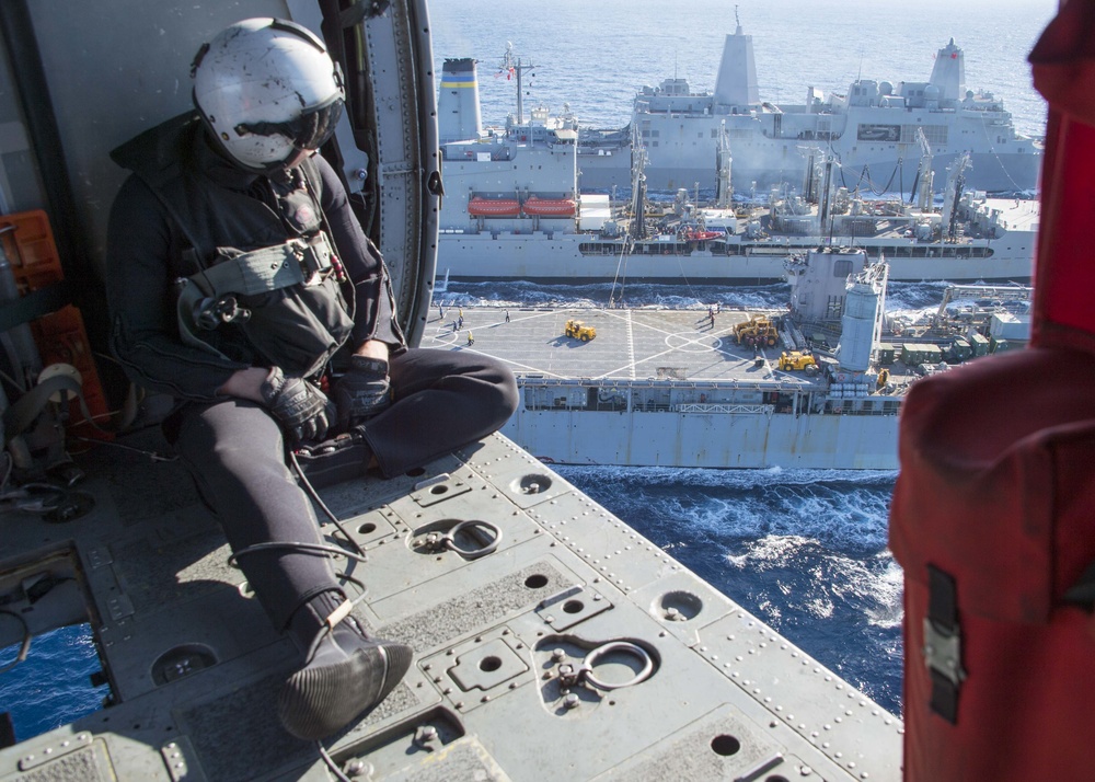 The amphibious transport dock ship USS New York (LPD 21), left, and the amphibious dock landing ship USS Oak Hill (LSD 51), right, receive fuel from the fleet replenishment oiler USNS Big Horn (T-AO 198) during a replenishment-at-sea