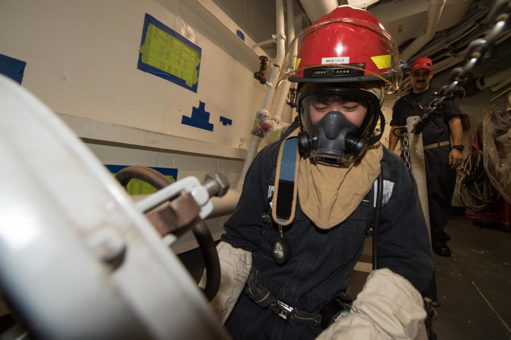 USS Pearl Harbor Sailors participate in a general quarters training exercise