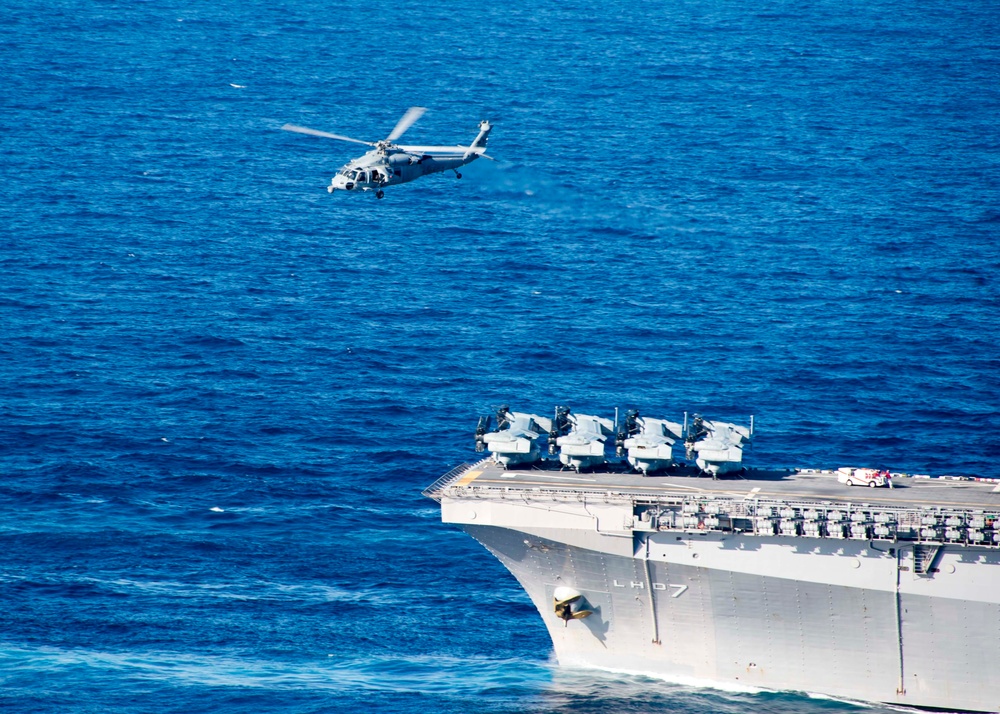 The amphibious transport dock ship USS New York (LPD 21), left, and the amphibious dock landing ship USS Oak Hill (LSD 51), right, receive fuel from the fleet replenishment oiler USNS Big Horn (T-AO 198) during a replenishment-at-sea