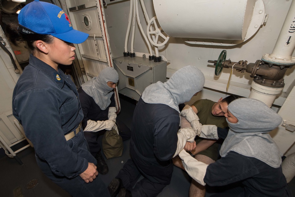 USS Pearl Harbor Sailors participate in a general quarters training exercise