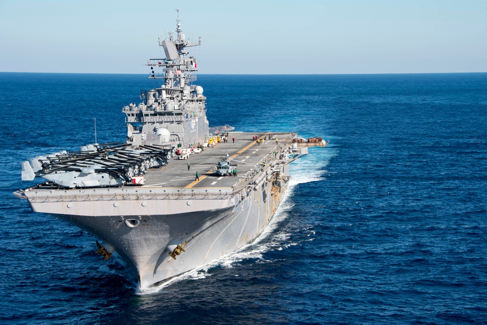 The amphibious transport dock ship USS New York (LPD 21), left, and the amphibious dock landing ship USS Oak Hill (LSD 51), right, receive fuel from the fleet replenishment oiler USNS Big Horn (T-AO 198) during a replenishment-at-sea