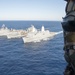 The amphibious transport dock ship USS New York (LPD 21), left, and the amphibious dock landing ship USS Oak Hill (LSD 51), right, receive fuel from the fleet replenishment oiler USNS Big Horn (T-AO 198) during a replenishment-at-sea