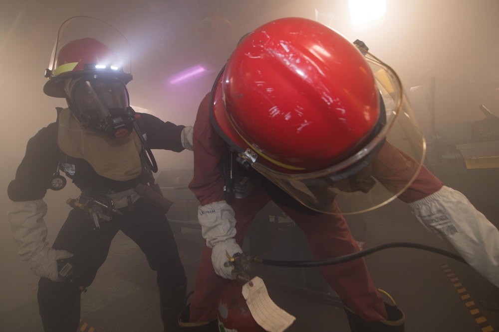 USS Pearl Harbor Sailors participate in a general quarters training exercise