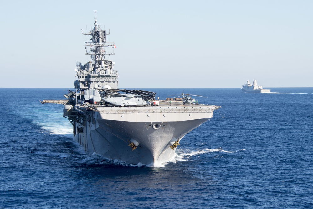 The amphibious transport dock ship USS New York (LPD 21), left, and the amphibious dock landing ship USS Oak Hill (LSD 51), right, receive fuel from the fleet replenishment oiler USNS Big Horn (T-AO 198) during a replenishment-at-sea