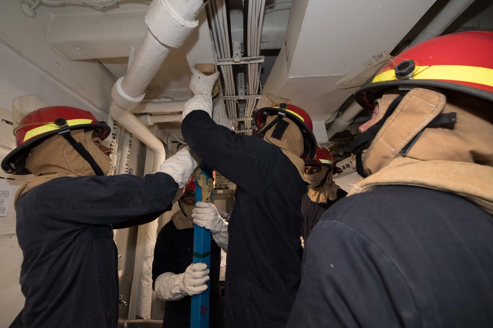 USS Pearl Harbor Sailors participate in a general quarters training exercise