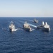 The amphibious transport dock ship USS New York (LPD 21), left, and the amphibious dock landing ship USS Oak Hill (LSD 51), right, receive fuel from the fleet replenishment oiler USNS Big Horn (T-AO 198) during a replenishment-at-sea