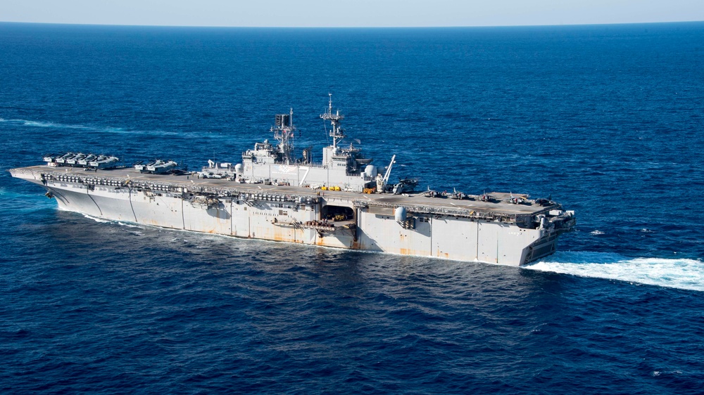 The amphibious transport dock ship USS New York (LPD 21), left, and the amphibious dock landing ship USS Oak Hill (LSD 51), right, receive fuel from the fleet replenishment oiler USNS Big Horn (T-AO 198) during a replenishment-at-sea