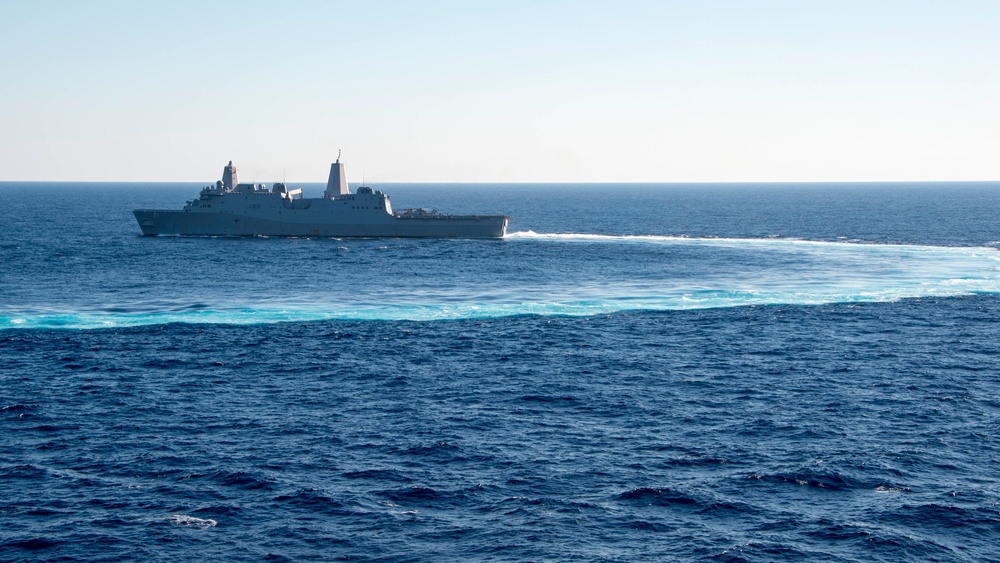 The amphibious transport dock ship USS New York (LPD 21), left, and the amphibious dock landing ship USS Oak Hill (LSD 51), right, receive fuel from the fleet replenishment oiler USNS Big Horn (T-AO 198) during a replenishment-at-sea