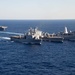 The amphibious transport dock ship USS New York (LPD 21), left, and the amphibious dock landing ship USS Oak Hill (LSD 51), right, receive fuel from the fleet replenishment oiler USNS Big Horn (T-AO 198) during a replenishment-at-sea