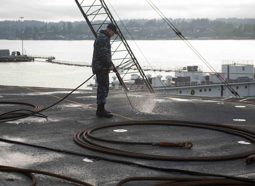 Sailor cleans flight deck