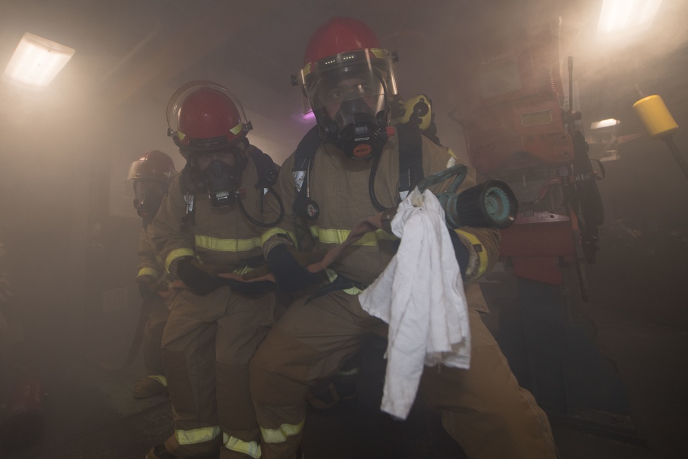 USS Pearl Harbor Sailors participate in a general quarters training exercise