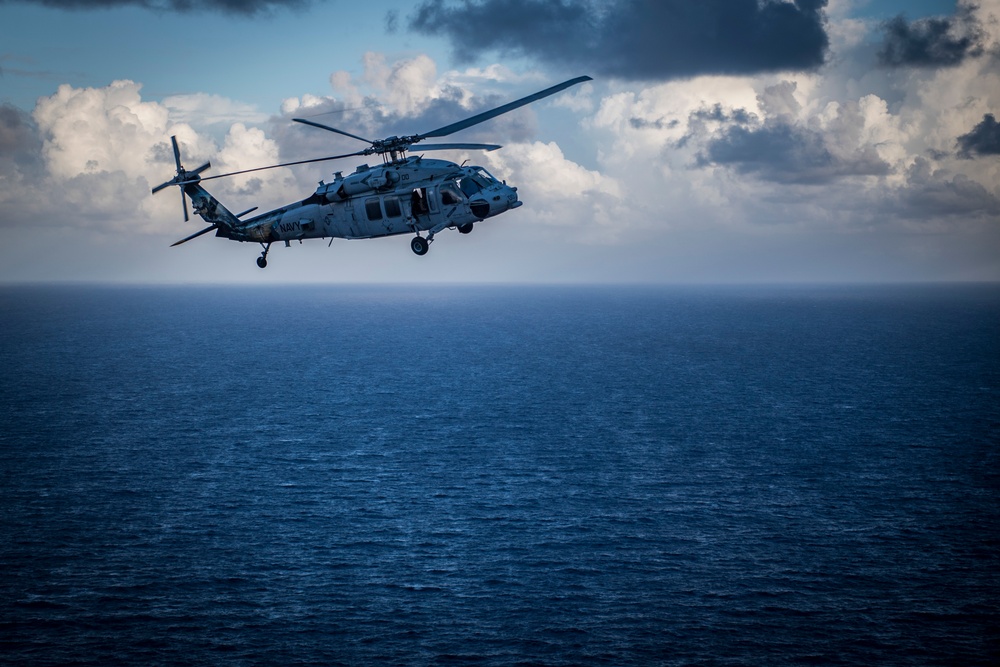 HSC-25 Helicopter Flies Over Tinian