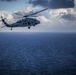 HSC-25 Helicopter Flies Over Tinian