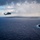 HSC-25 Helicopter Flies Over Tinian