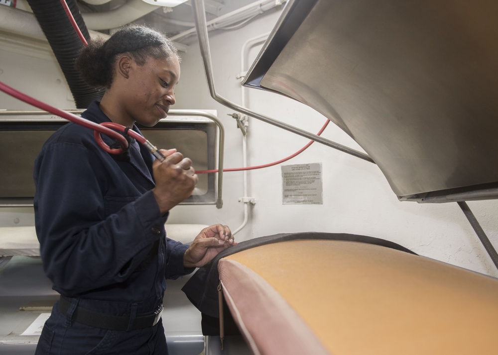 USS Lake Erie (CG 70) Ship's Serviceman presses uniform