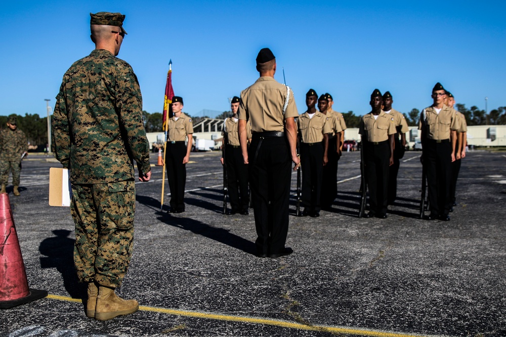 Marines judge a local high school drill meet