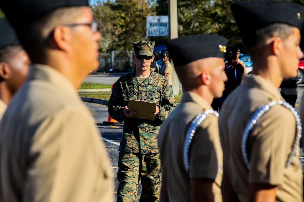 Marines judge a local high school drill meet