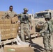 U.S. Army soldiers assigned to 1st Squadron, 7th Cavalry Regiment, 1st Brigade Combat Team, 1st Cavalry Division, distribute Meals Ready to Eat