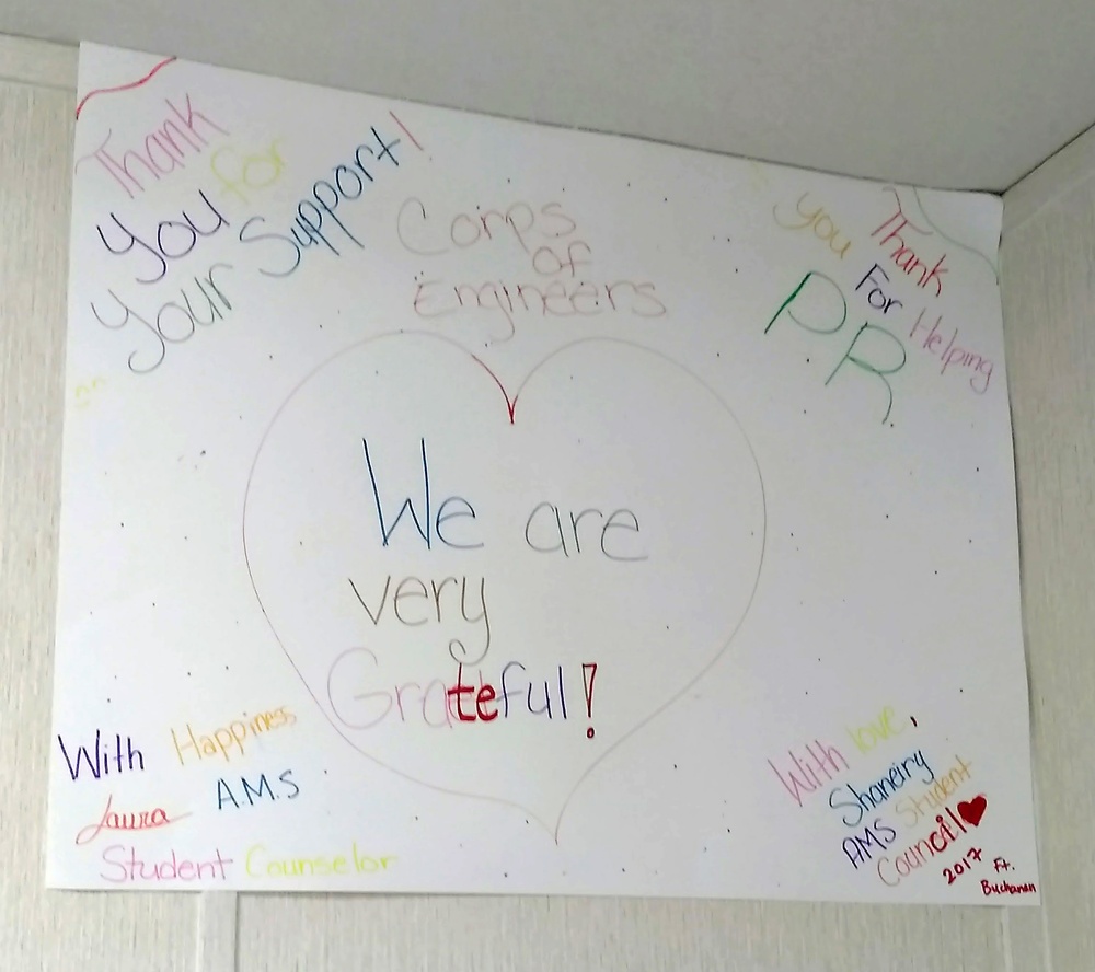 Students thank USACE Power Team with posters to brighten their office