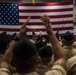 Sailors participate in a frocking ceremony.