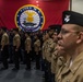 Sailors participate in a frocking ceremony.