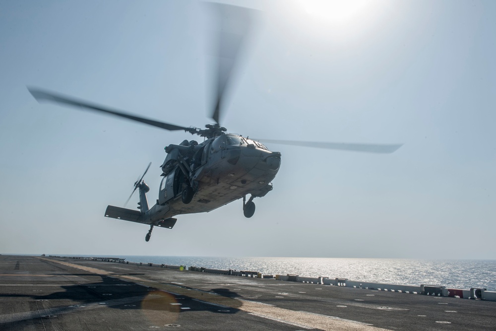 USS America helicopter lands on flight deck
