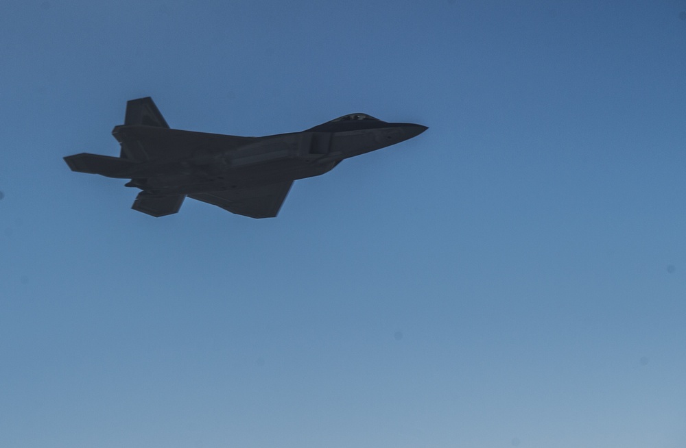 908th Expeditionary Air Refueling Squadron supports F-22 Raptors conducting airstrikes in Iraq and Syria
