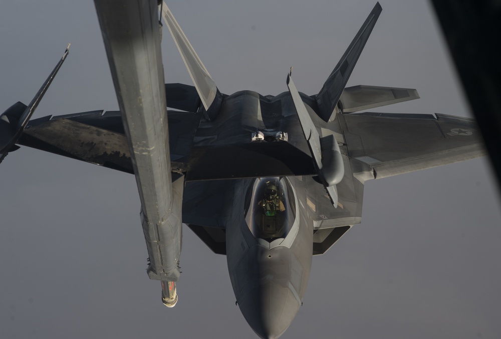 908th Expeditionary Air Refueling Squadron supports F-22 Raptors conducting airstrikes in Iraq and Syria