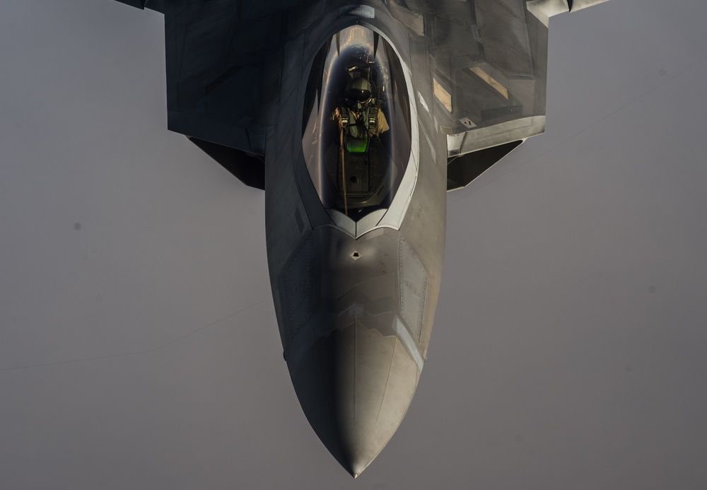 908th Expeditionary Air Refueling Squadron supports F-22 Raptors conducting airstrikes in Iraq and Syria