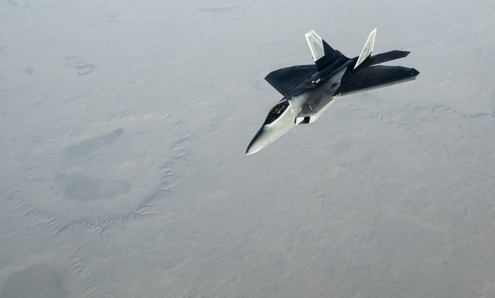 908th Expeditionary Air Refueling Squadron supports F-22 Raptors conducting airstrikes in Iraq and Syria