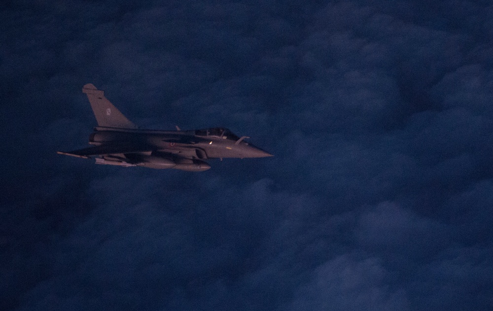 F-22 Raptors and Coalition Rafaels conduct airstrikes in Iraq and Syria