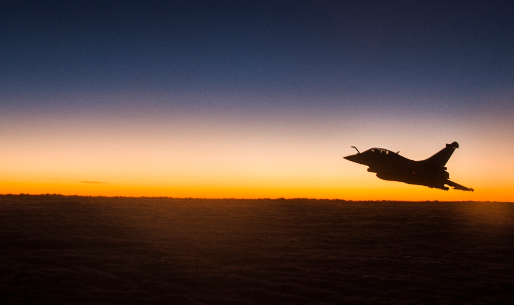 F-22 Raptors and Coalition Rafaels conduct airstrikes in Iraq and Syria