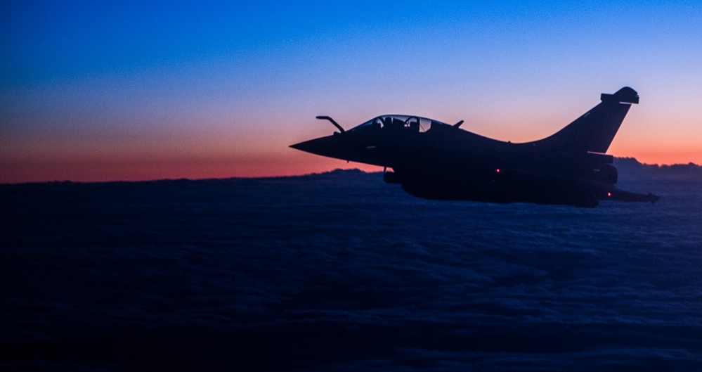 F-22 Raptors and Coalition Rafaels conduct airstrikes in Iraq and Syria